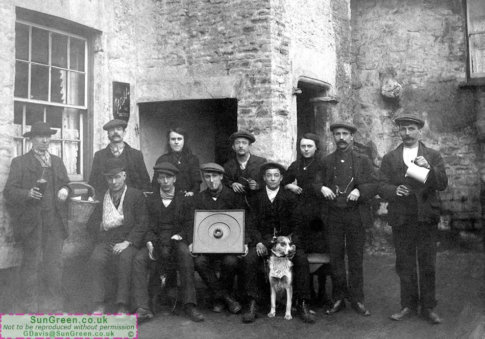 An old photo of the New Inn Bream with customers outside.