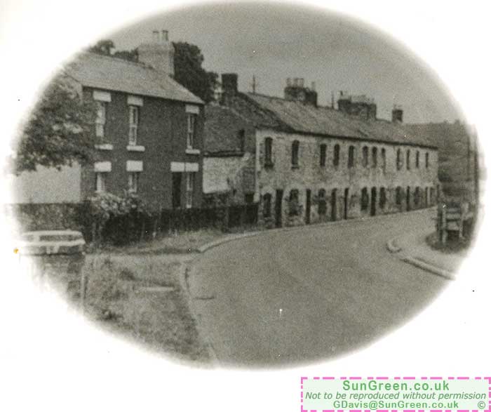 An old photo of Furnace Row, a row of cottgages in Cinderford