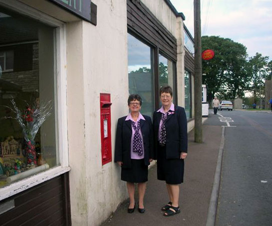 A photo of Sylvia and Janet at Family Affair Post Office in 2008