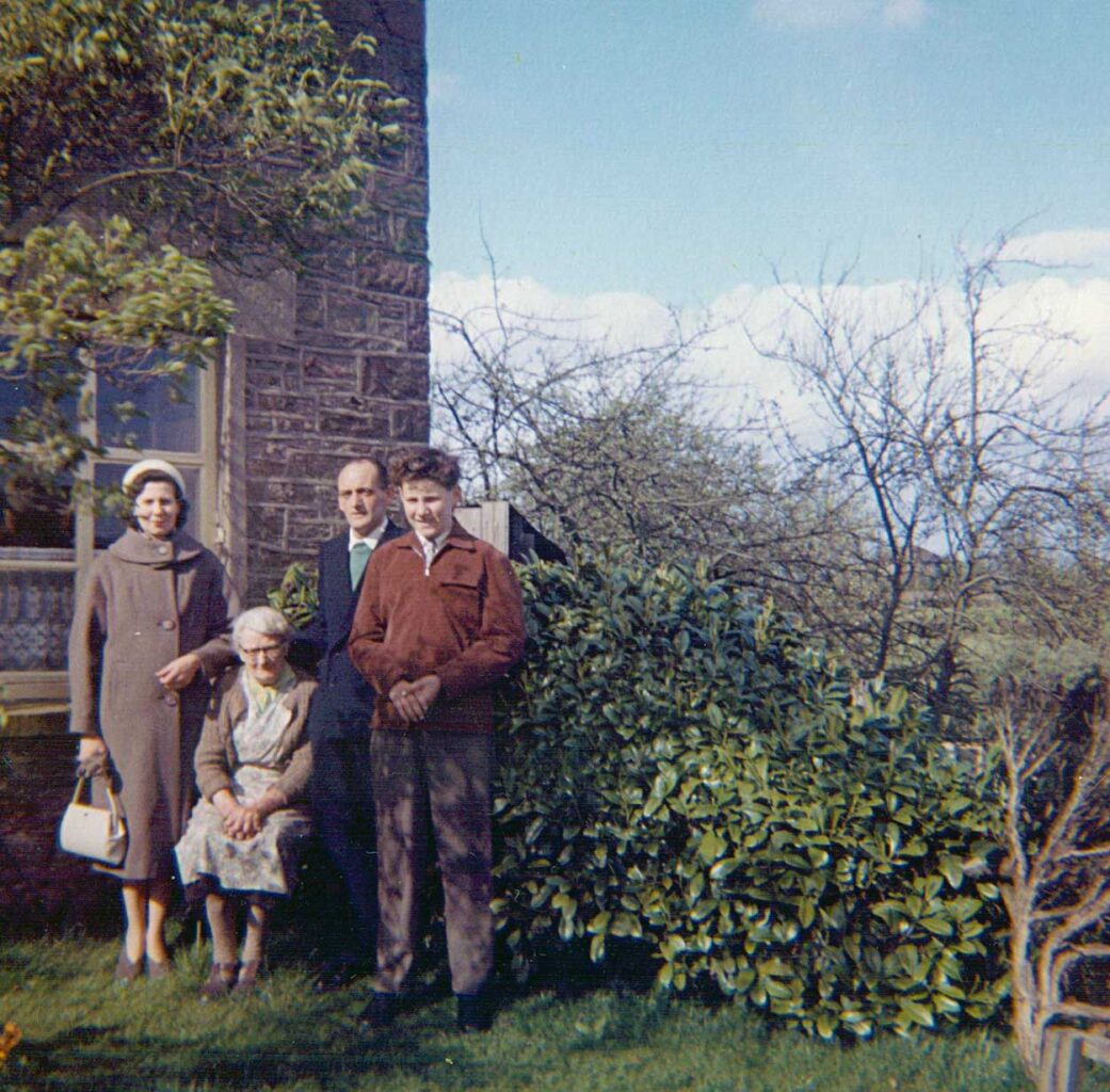 A photo of family members in front of Bannock Tree Cottage.