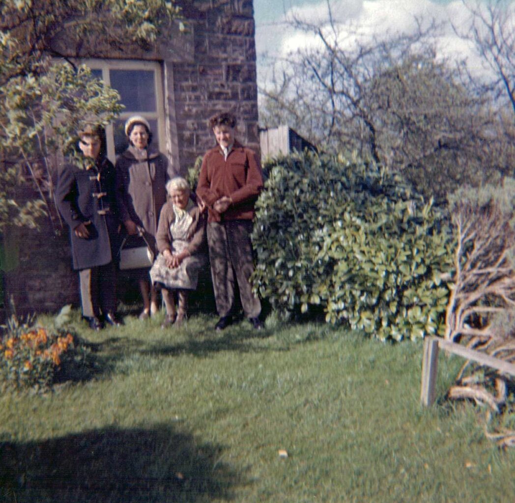 A family photo taken at the front of Bannock Tree Cottage