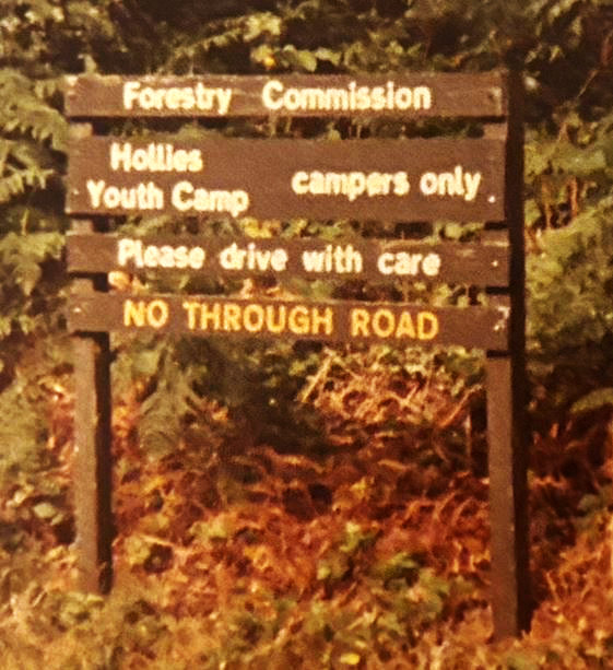 A photo of a sign to The Hollies